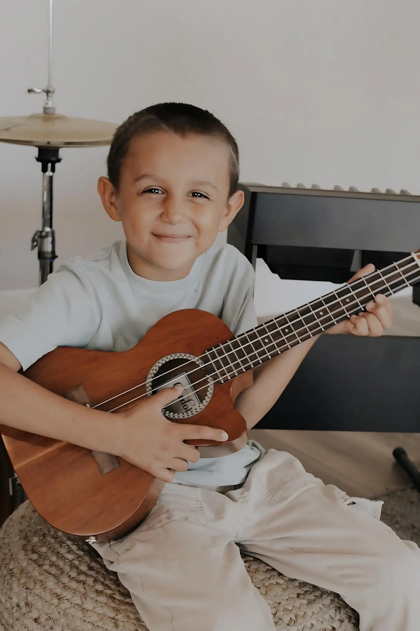 Boy playing ukulele